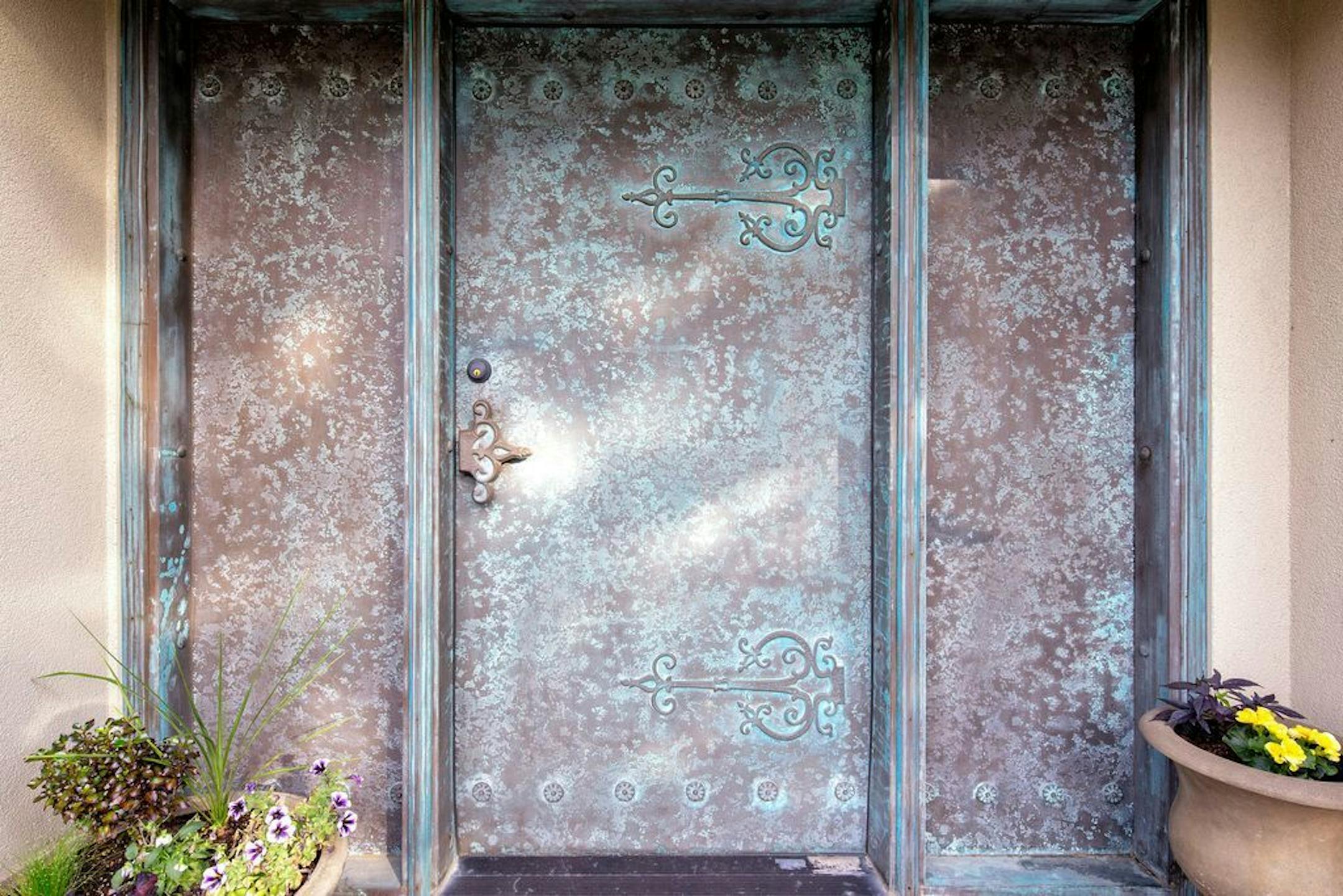 Bronze doors lead to the wine room, which has its own entrance.