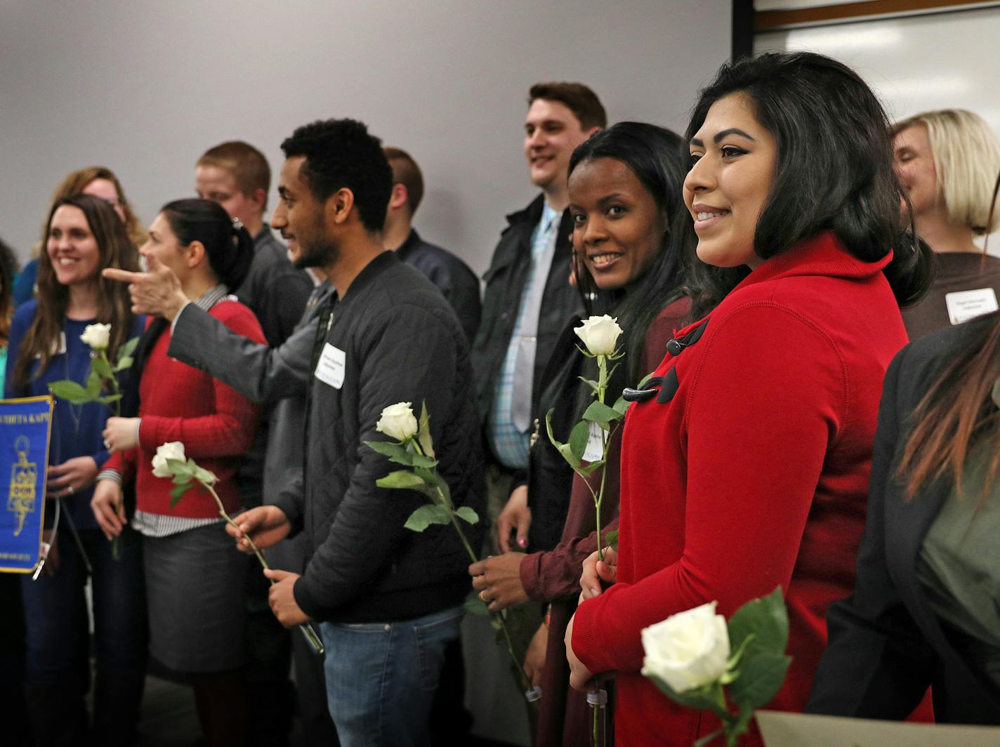 Maya Tackaberry, in red, posed for a photo with fellow inductees following an induction ceremony to the Pi Beta Kappa honor society Thursday. ] ANTHONY SOUFFLE &#xd4; anthony.souffle@startribune.com For the first time ever, The Women's Foundation of Minnesota has awarded grants to individuals--promising young women with ideas that will help other women and girls. Microgrant recipient Maya Tackaberry attended an induction ceremony for the Pi Beta Kappa honor society Thursday, April 13, 2018 at St