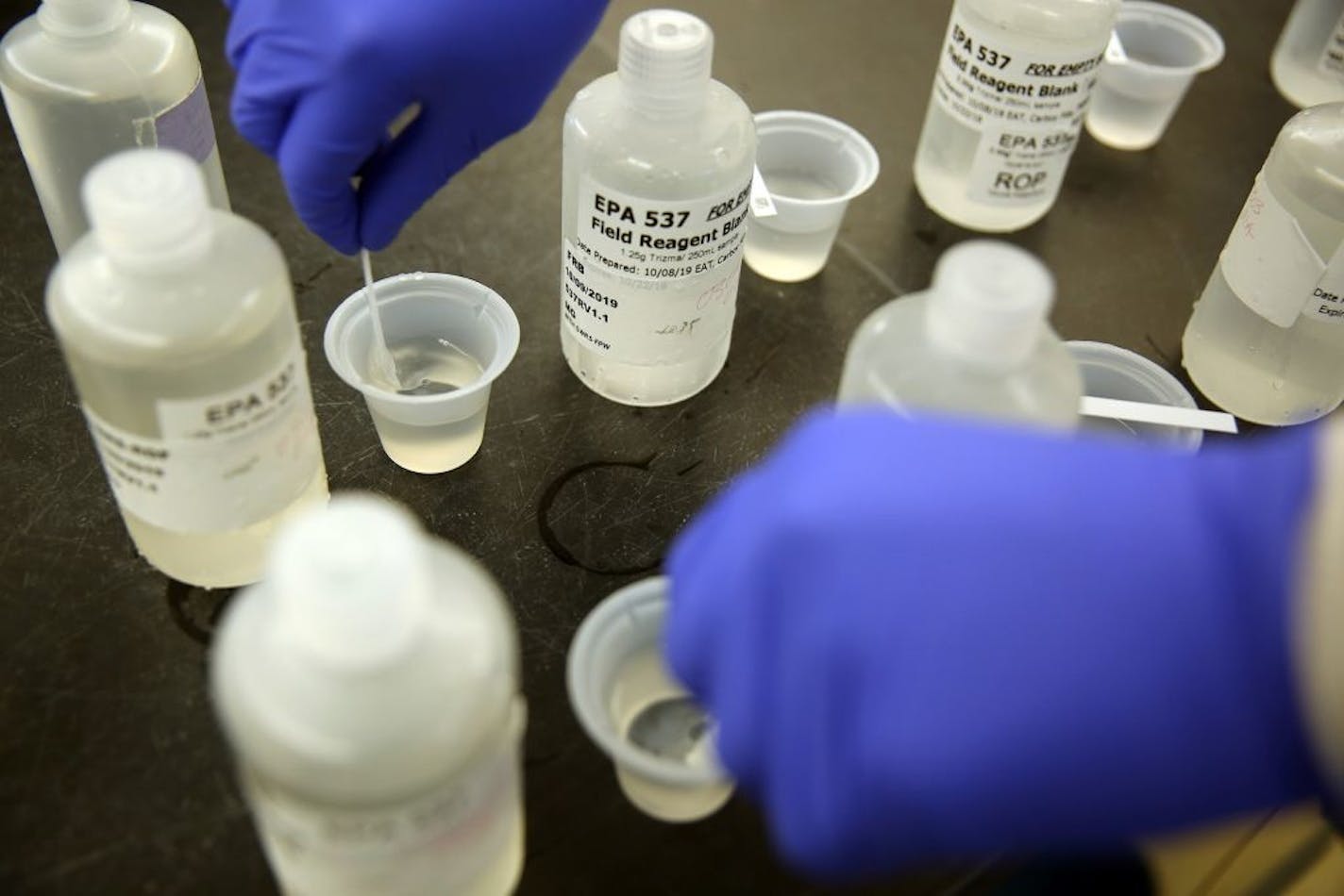 Twan Nguyen checks for chlorine from samples at the Orange County Water District on Oct. 9, 2019 in Orange County, Calif. Officials will release new water quality results this week that will show widespread contamination of PFAS, a toxic chemical linked to cancer.