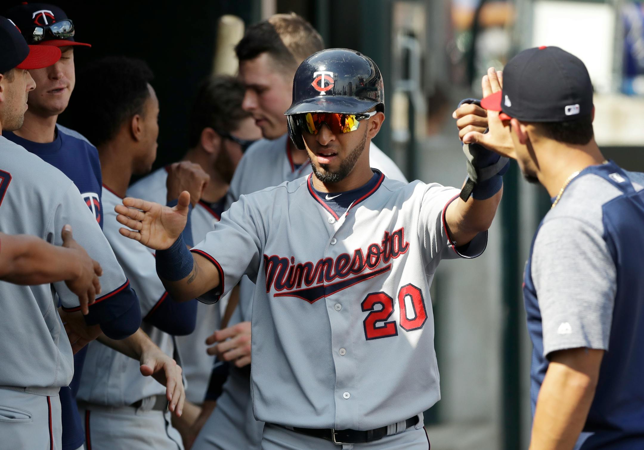 The Twins' Eddie Rosario was greeted in the dugout after scoring the tie-breaking run on a single by Byron Buxton in the eighth inning against the Detroit Tigers on Sunday.