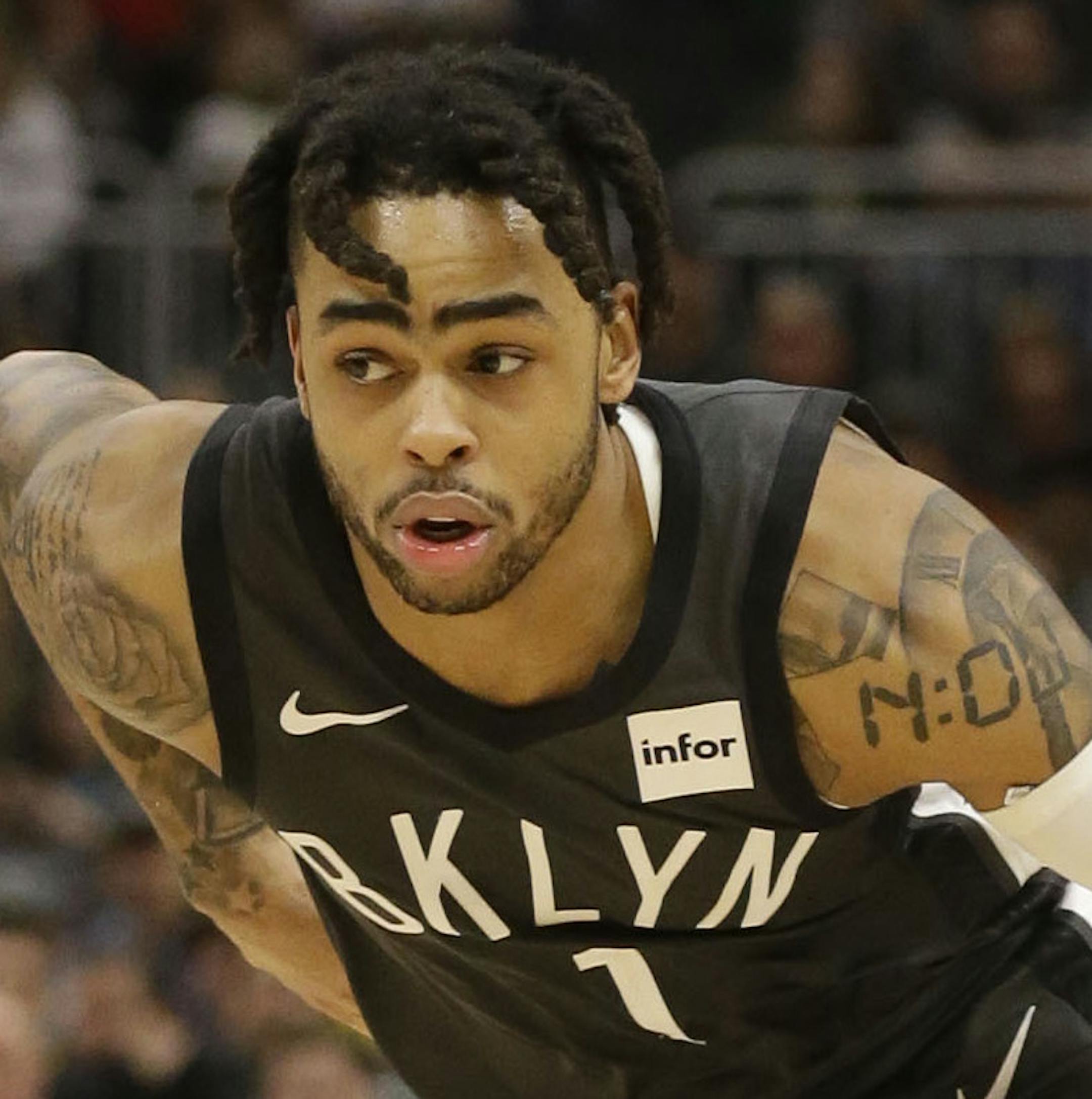 Brooklyn Nets' D'Angelo Russell, right, drives against the Milwaukee Bucks' Ersan Ilyasova, left, during the second half of an NBA basketball game Saturday, April 6, 2019, in Milwaukee. (AP Photo/Jeffrey Phelps)