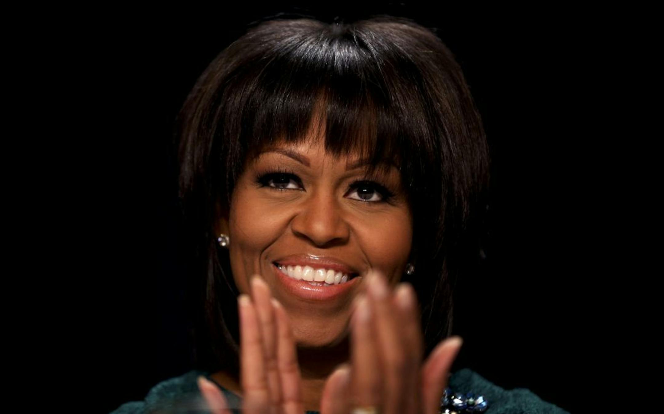 First lady Michelle Obama applauds at the National Prayer Breakfast at the Washington Hilton hotel in Washington, Feb, 7, 2013.
