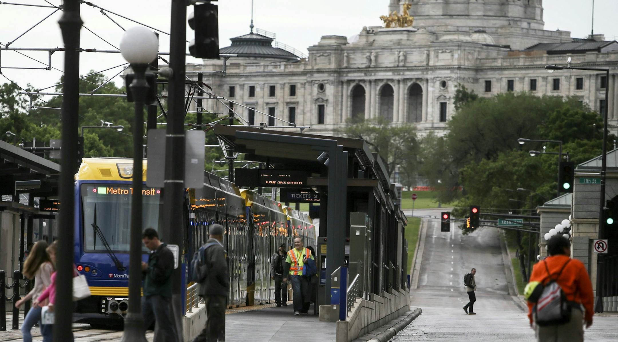 Trains and people come and go at the 10th Street station Saturday, June 14, 2014, near the Capitol in St. Paul, MN.] (DAVIDJOLES/STARTRIBUNE) djoles@startribune.com After more than a decade of planning and nearly a billion dollars of public money, the Twin Cities' second light-rail line begins running Saturday as officials cut ribbons for the Green Line. ORG XMIT: MIN1406141944190710