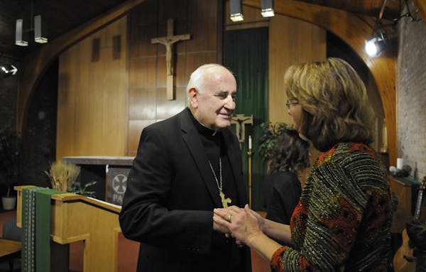 Bishop Donald Kettler meets with people following a news conference to announce his appointment to the St. Cloud diocese Friday, Sept. 20, 2013, in St