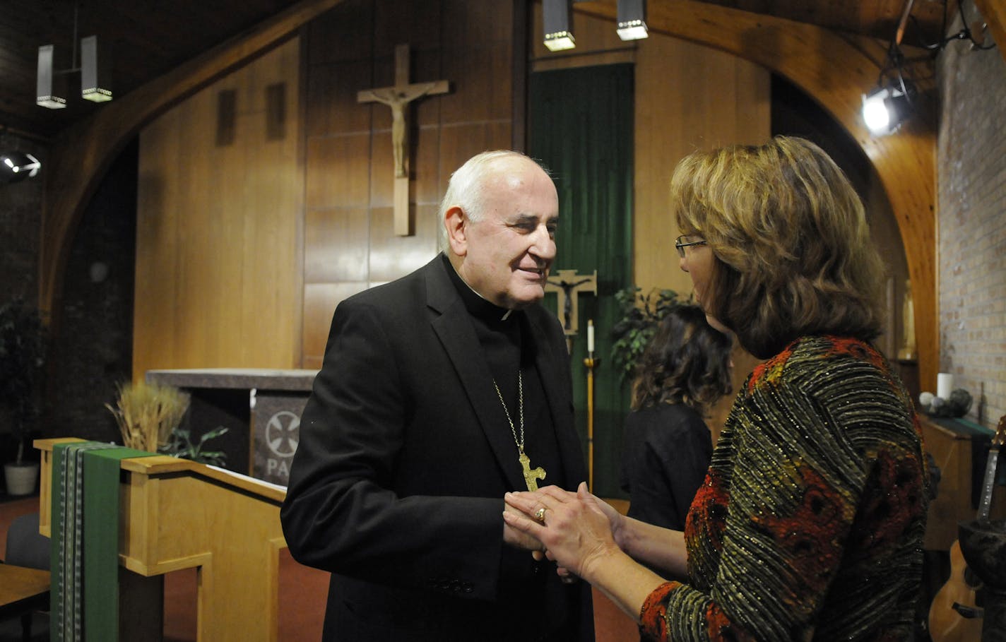 Bishop Donald Kettler meets with people following a news conference to announce his appointment to the St. Cloud diocese Friday, Sept. 20, 2013, in St. Cloud, Minn. Kettler has been the Bishop of Fairbanks since 2002. (AP Photo/The St. Cloud Times, Dave Schwarz)