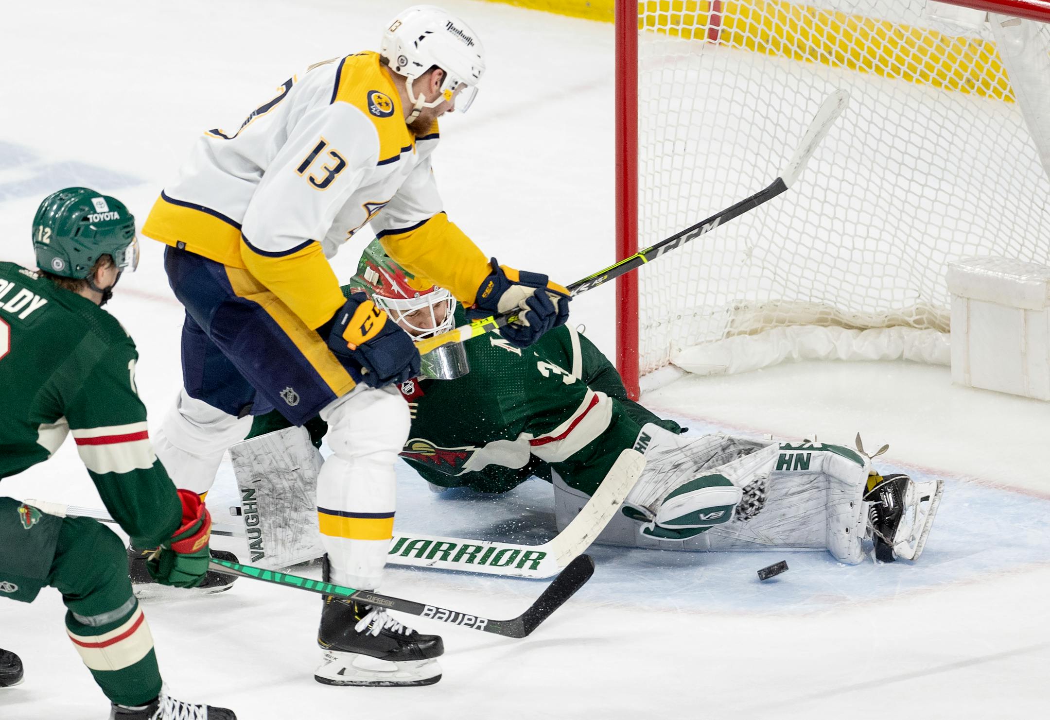 Minnesota Wild goalie Kaapo Kahkonen (34) blocks a shot by Yakov Trenin (13) of the Nashville Predators in the second period.