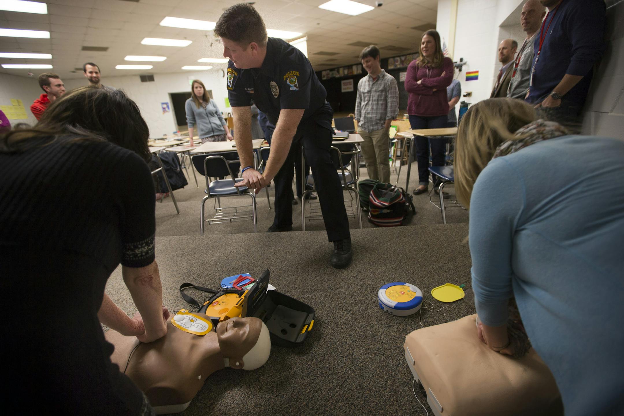 Officer Bryan Platz demonstrated the way to hold your hands during a class for a group of teachers at Coon Rapids High School on Thursday, February 11, 2016, in Coon Rapids, Minn. ] RENEE JONES SCHNEIDER • reneejones@startribune.com