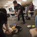 Officer Bryan Platz demonstrated the way to hold your hands during a class for a group of teachers at Coon Rapids High School on Thursday, February 11