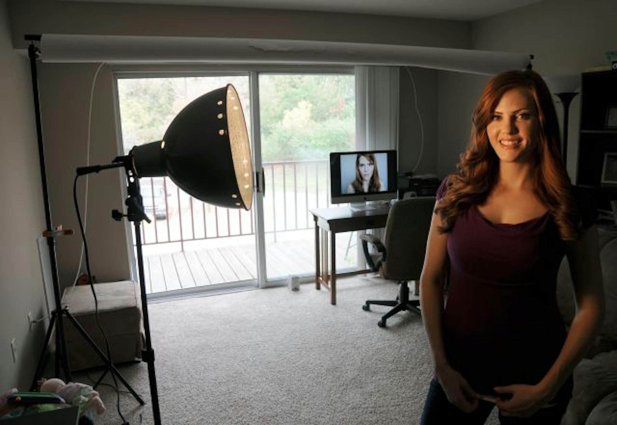 Karen Alloy, in her Minnetonka apartment, says it's important to invest in high-quality equipment to succeed as a YouTube blogger, because "people insist on seeing you in HD these days.