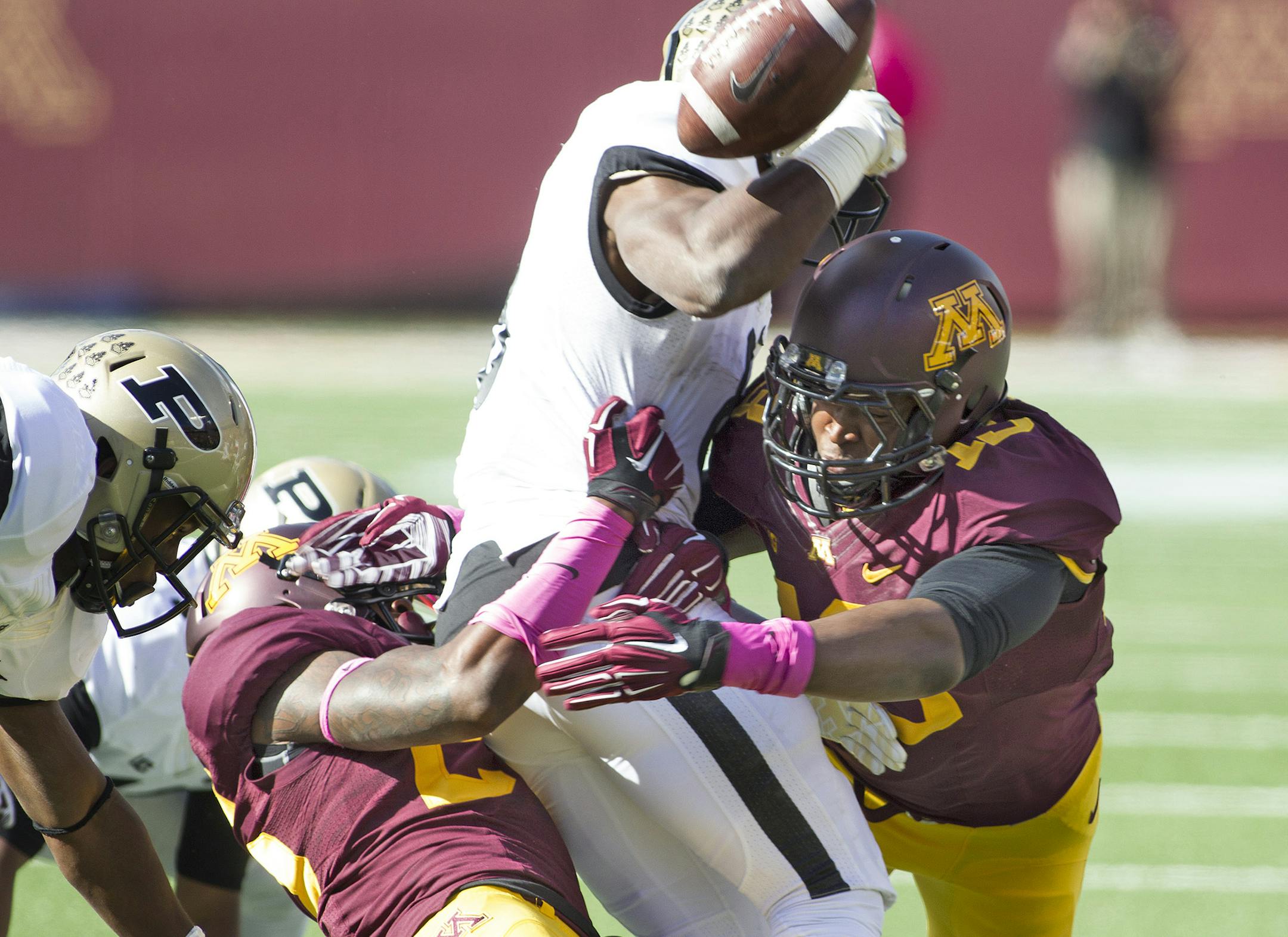 October 18, 2014 Gophers linebacker Jonathan Celestin (13) causes a fumble from Boilermakers running back Raheem Mostert (8) during a kickoff in the first quarter at the Minnesota Gophers game versus Purdue Boilermakers at TCF Bank Stadium in Minneapolis MN. (Icon Sportswire via AP Images) ORG XMIT: 231646