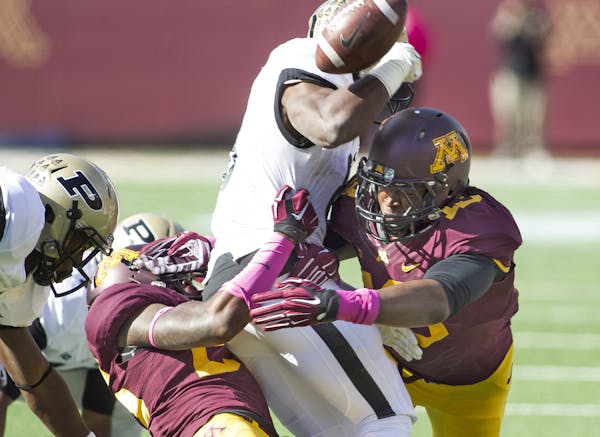 October 18, 2014 Gophers linebacker Jonathan Celestin (13) causes a fumble from Boilermakers running back Raheem Mostert (8) during a kickoff in the f