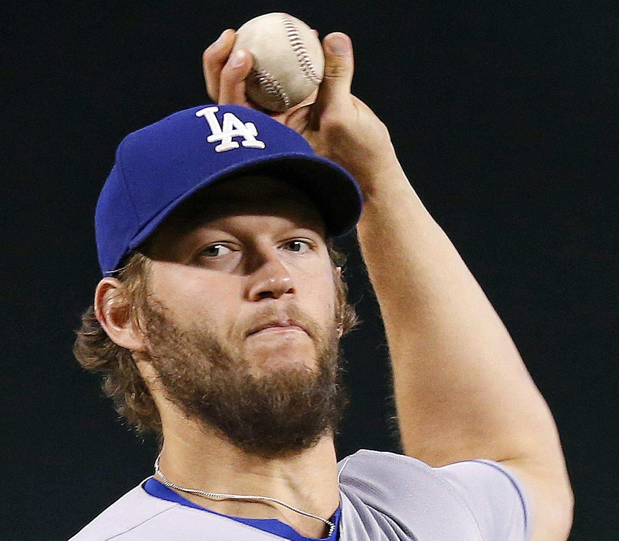 Los Angeles Dodgers' Clayton Kershaw throws a pitch against the Arizona Diamondbacks during the first inning of a baseball game Wednesday, June 15, 2016, in Phoenix. The Dodgers defeated the Diamondbacks 3-2. (AP Photo/Ross D. Franklin)