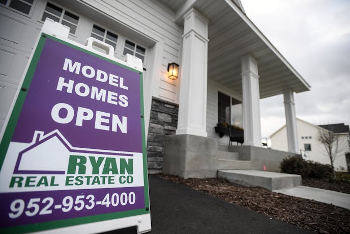 A model home in the Summerlin neighborhood of Woodbury. ] AARON LAVINSKY &#xef; aaron.lavinsky@startribune.com Home sales in the Twin Cities metro during October were flat compared with last year, but not for lack of interest. House listings were down, limiting options for an abundance of first-time buyers, according to a monthly sales report from the Minneapolis Area Association of Realtors. Sales of move-up houses like the new houses Michelle Fitzpatrick sells in Woodbury, however, have been o