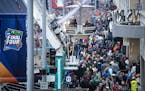 The scene on Nicollet Mall last month as people ride the ferris wheel at Tip-Off Tailgate.