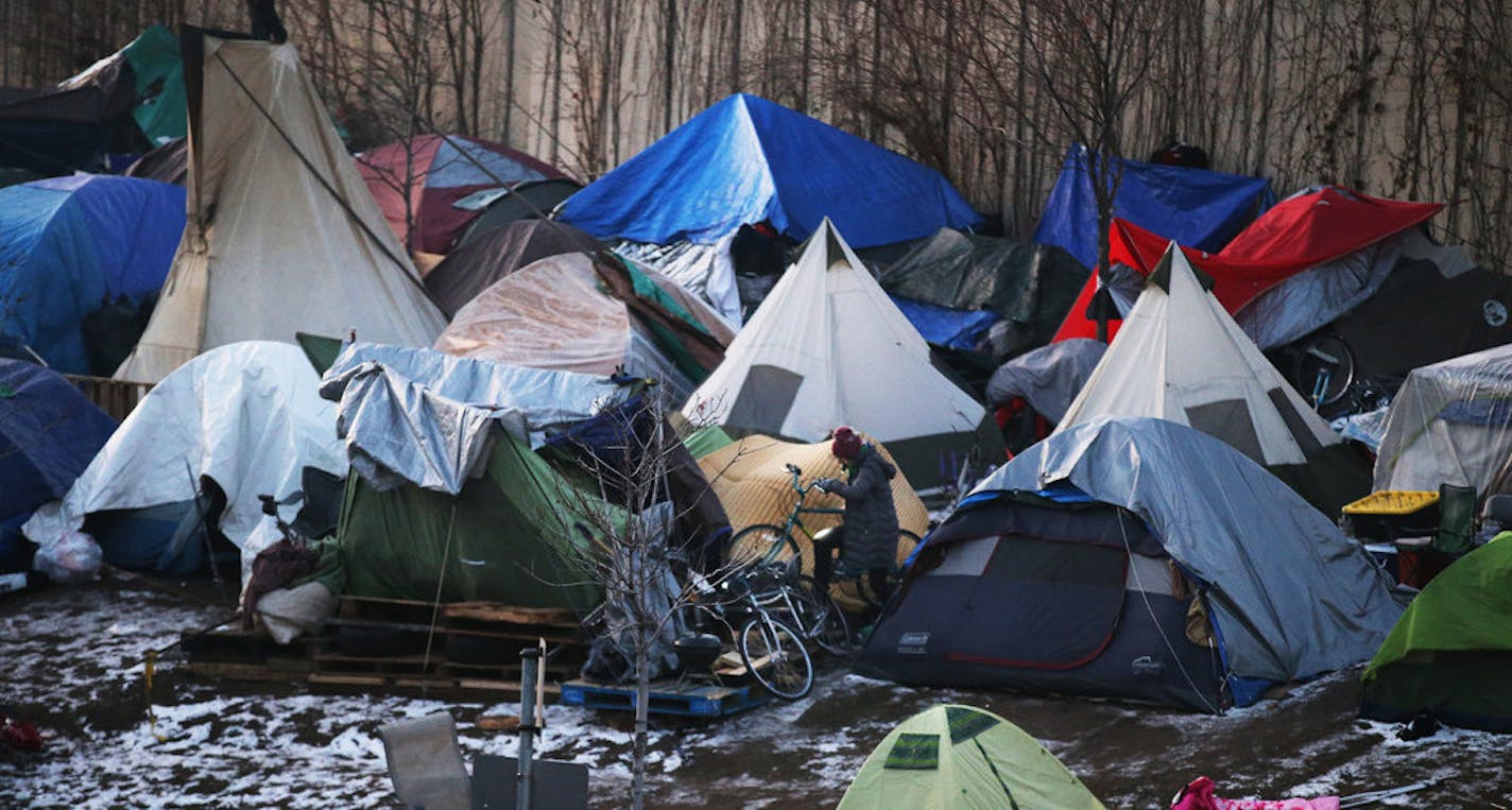 A new state Medicaid program will provide housing services to people with mental health problems and other disabilities, and help them avoid becoming homeless. In 2018, hundreds of people lived in tents at this homeless camp along Hiawatha Ave. in Minneapolis.