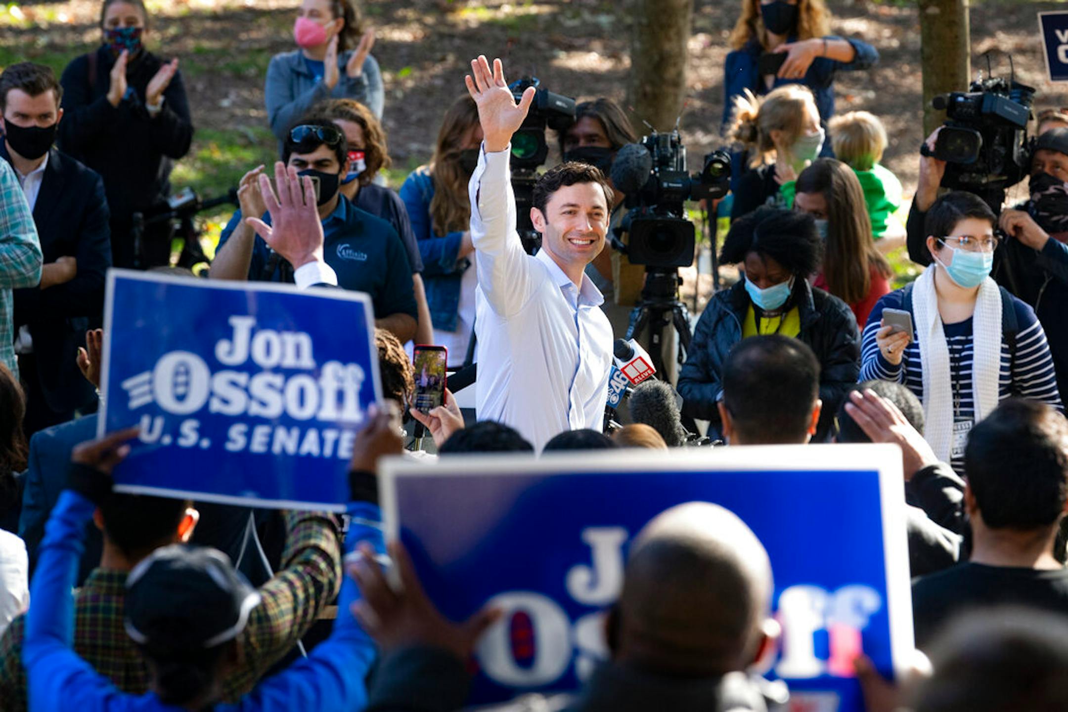 Georgia Democratic candidate for U.S. Senate Jon Ossoff rallies supporters for a run-off against Republican candidate Sen. David Perdue, as they meet in Grant Park, Friday, Nov. 6, 2020, in Atlanta. (AP Photo/John Amis)