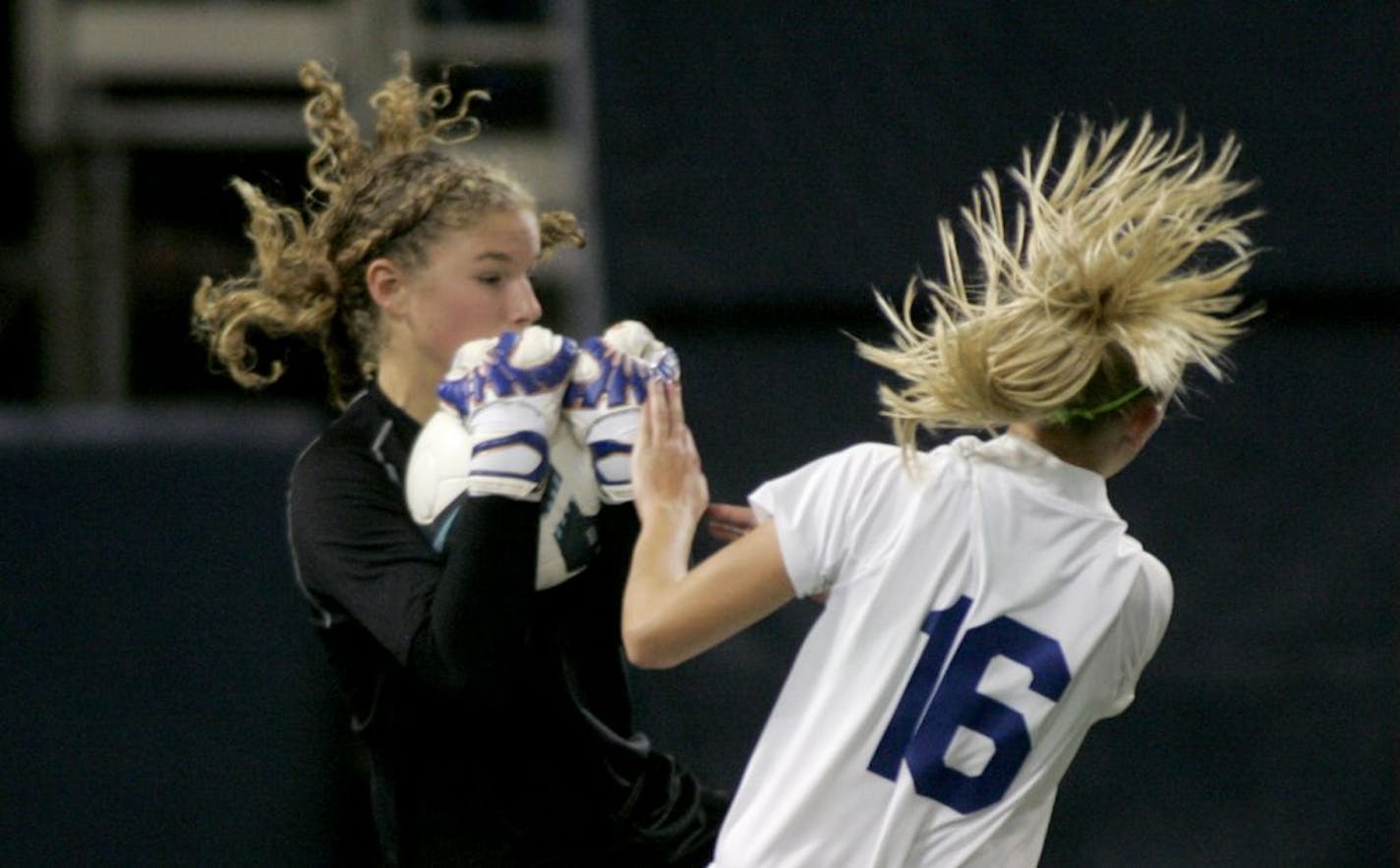 Eagan goalie Kristen Knutson (left)