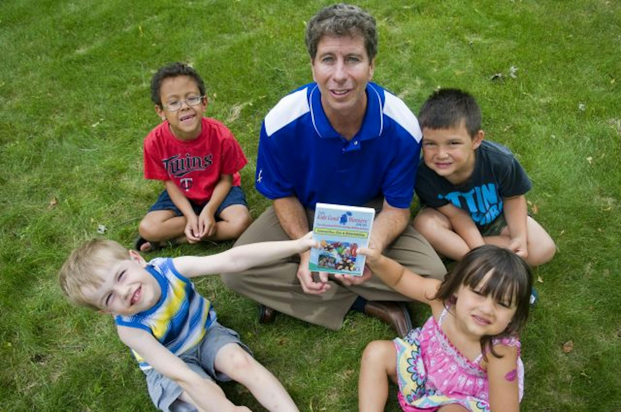 Ira Hackner, creator of the "Kids Good Manners" DVD, with children from the Heidi Bloom Family Child Care. Clockwise from bottom left: Nat Nelson, 5; Tyler Hackner, 8; Brady Huynh, 5, and Breanna Huynh, 3.