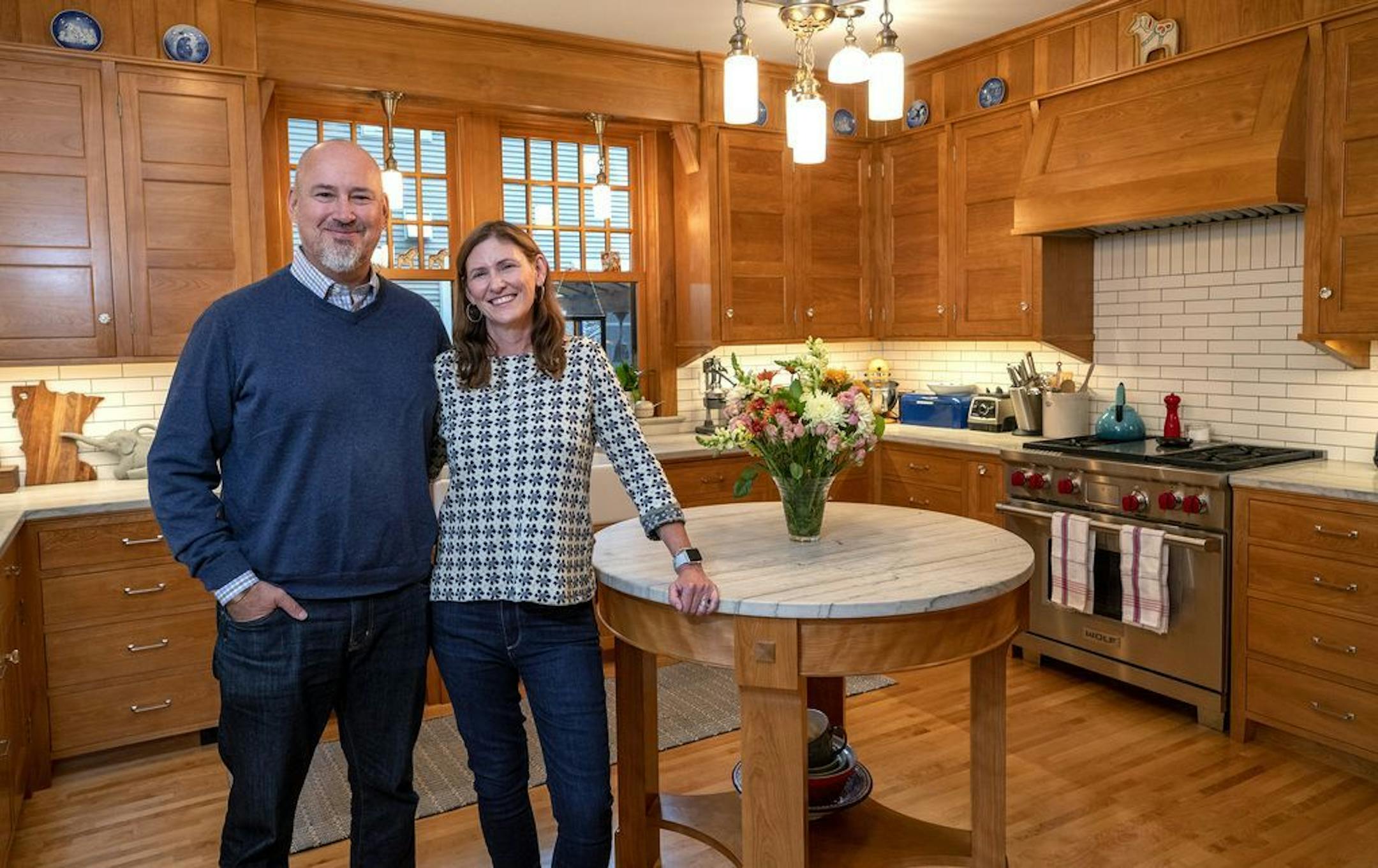 Chip and Amy Pearson in the kitchen of their St. Paul home, which they recently restored with help from David Heide Design Studio.