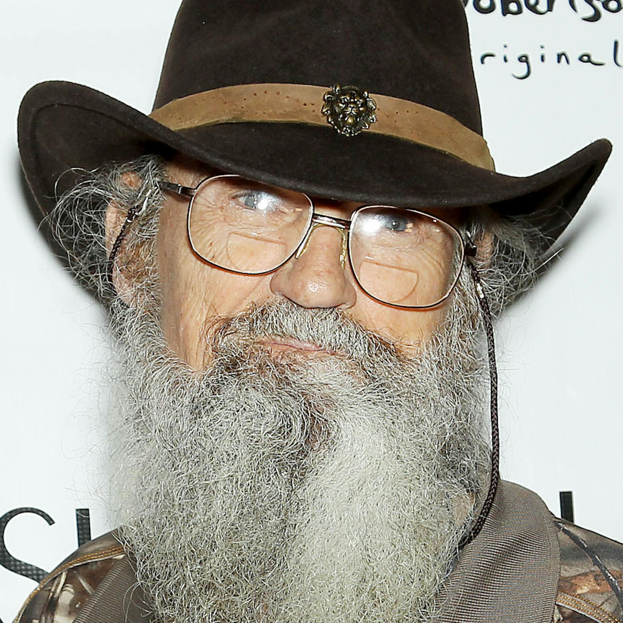 This image released by Starpix shows TV personalities,from left, Jep Robertson, Si Robertson, and Willie Robertson, from the A&E series "Duck Dynasty," at the Sherri Hill Fashion Show, Monday, Sept. 9, 2013, in New York. The Robertsons attended to support Willie's daughter Sadie Robertson who modeled several outfits for the show. (AP Photo/Starpix, Marion Curtis) ORG XMIT: MIN2013093017540768