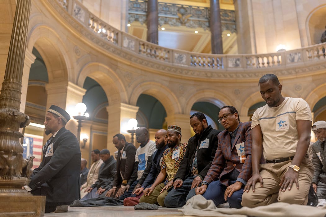 Some Uber drivers joined for prayer before Sen. Omar Fateh's bill was up in the Senate Commerce Committee Tuesday.