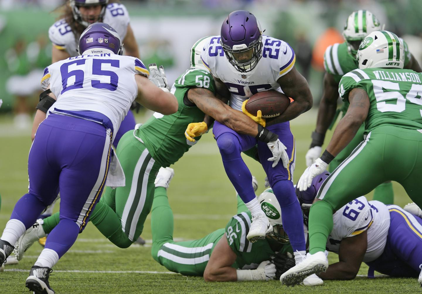 Minnesota Vikings running back Latavius Murray (25) is tackled by New York Jets' Kevin Pierre-Louis (56) during the first half of an NFL football game Sunday, Oct. 21, 2018, in East Rutherford, N.J. (AP Photo/Bill Kostroun)