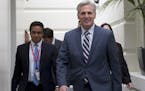 House Majority Leader Kevin McCarthy of Calif., right, arrives for a House Republican Conference on Capitol Hill in Washington, Tuesday, Sept. 29, 201
