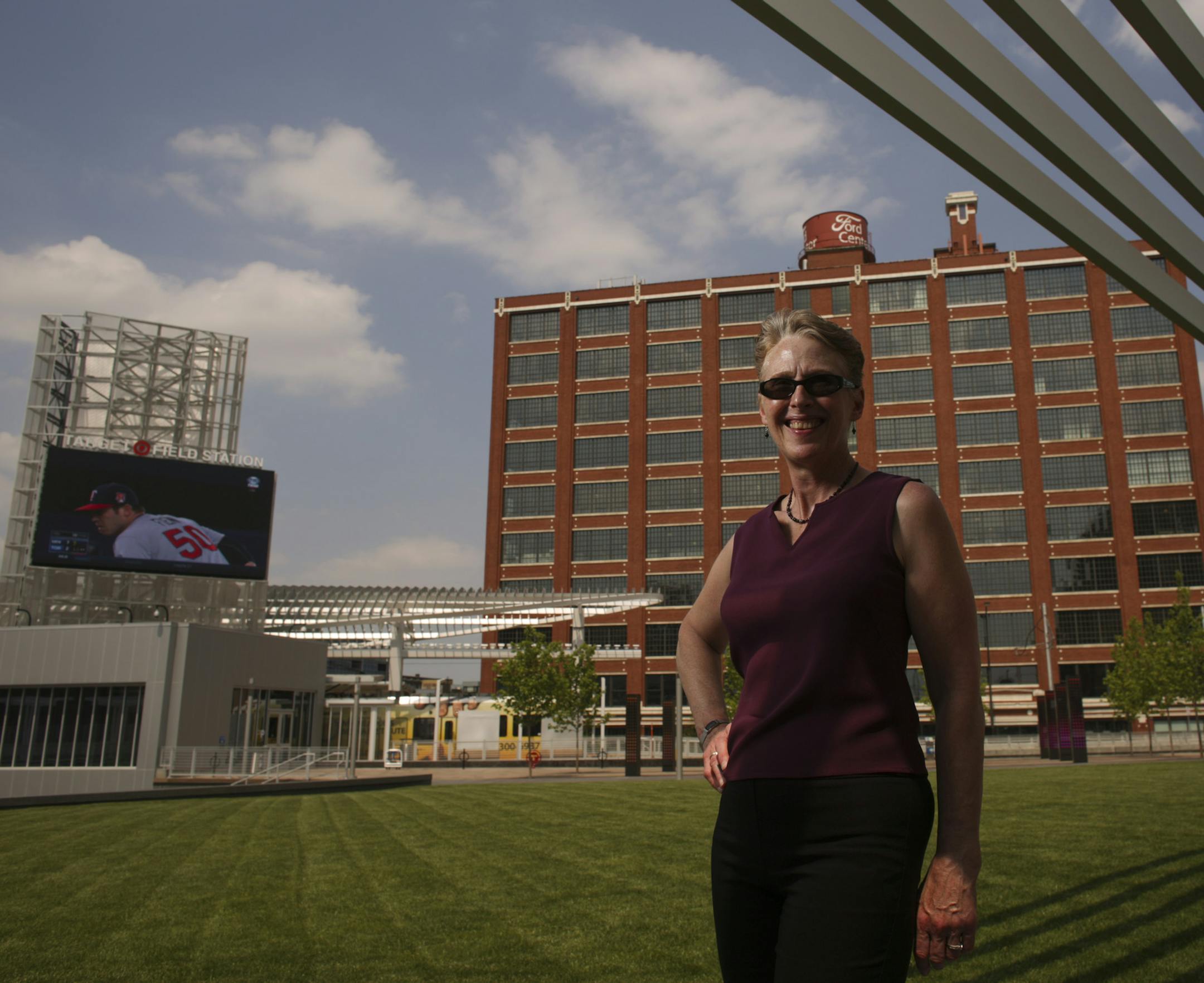 Karen Lee Rosar near the Great Lawn at the next to the new Target Field Station Wednesday afternoon, with a live Twins game being broadcast from Toronto on the big screen. ] JEFF WHEELER ‚Ä¢ jeff.wheeler@startribune.com The resurgent western edge of downtown Minneapolis takes a star turn next month with a spotlight shining on Target Field and its neighbors. Major League Baseball's All-Star Game rolls into town for a few days of action and a smaller-scale preview of what's happen