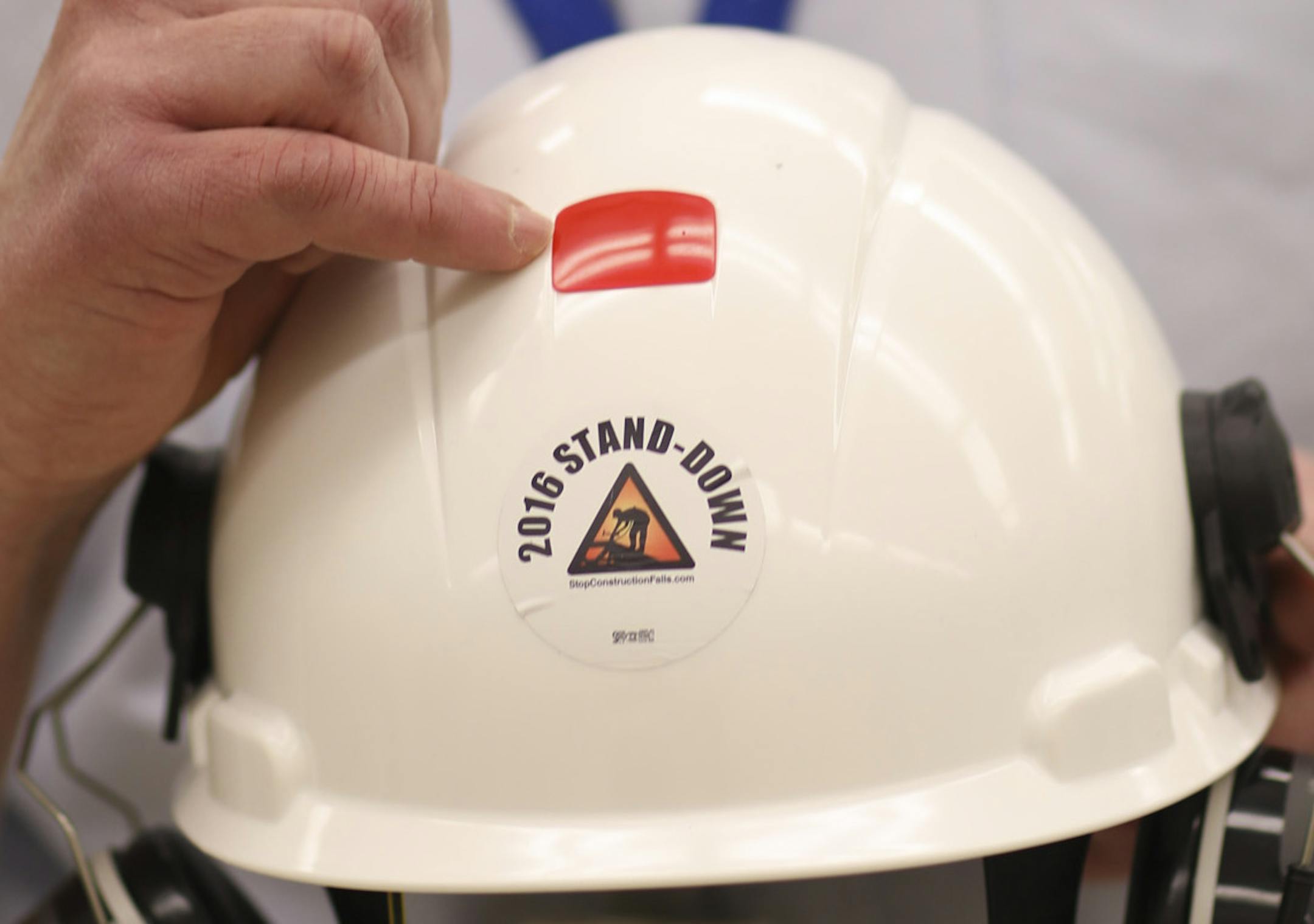 Don Garvey points out the photo sensitive patch on a construction worker's helmet that will indicate by changing color when it should be replaced. ] JEFF WHEELER ï jeff.wheeler@startribune.com 3M greatly expanded its safety products in June 2015 when it bought Capital Safety. We look at some of their new offerings during a visit to their safety products lab Thursday, February 16, 2017 at 3M's campus in Maplewood.