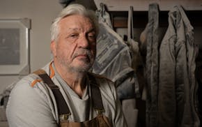 Zoran Mojsilov, a Serbian sculptor who has been in Minnesota for nearly 40 years, poses for a portration in his Northeast Minneapolis studio. Photo by