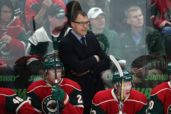Wild assistant coach Scott Stevens watches from behind the bench during the first period. ] ANTHONY SOUFFLE &#xef; anthony.souffle@startribune.com Gam