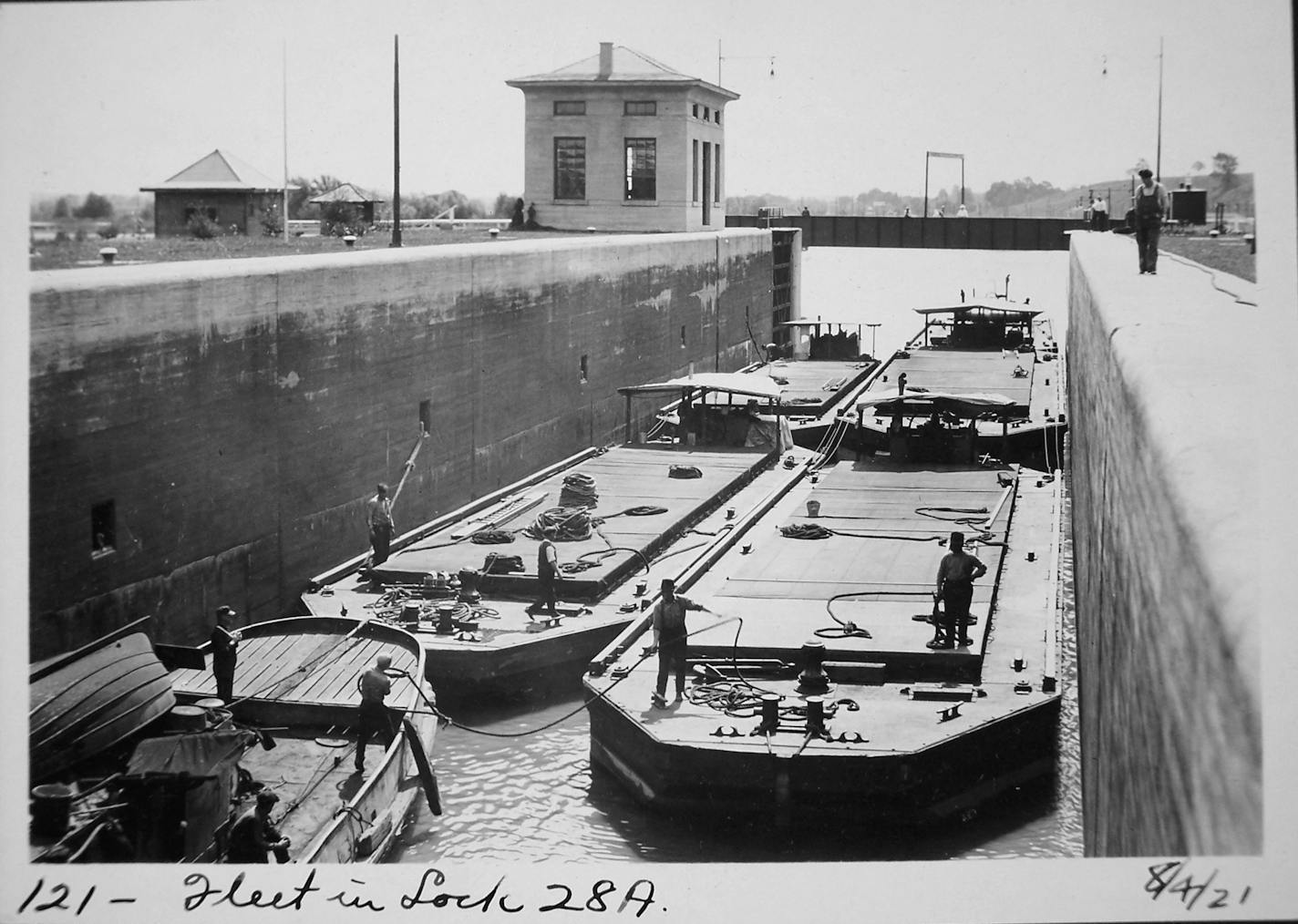 A Steel barge fleet at Erie Canal lock E28A in August 1921. (New York State Archives, Albany)