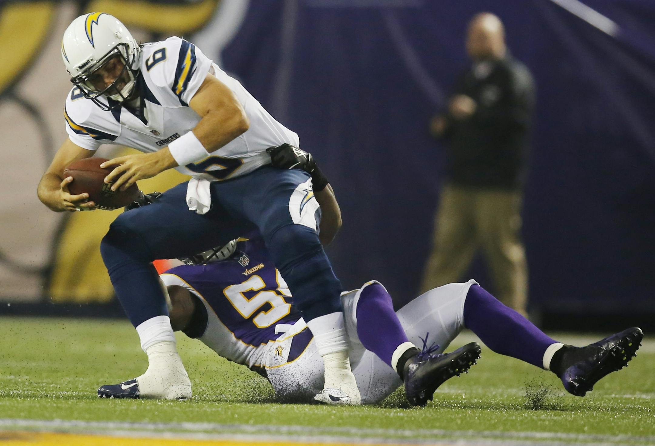 San Diego Chargers quarterback Charlie Whitehurst (6) was sacked by Minnesota Vikings linebacker Jasper Brinkley (54) during NFL preseason action between the Minnesota Vikings and the San Diego Chargers in Minneapolis , Minnesota Thursday August 23, 2012.