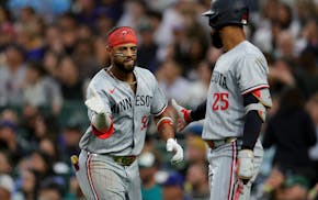The Twins' Willi Castro, left, celebrates with Byron Buxton after hitting a solo home run during the seventh inning. Castro hit another in the ninth.
