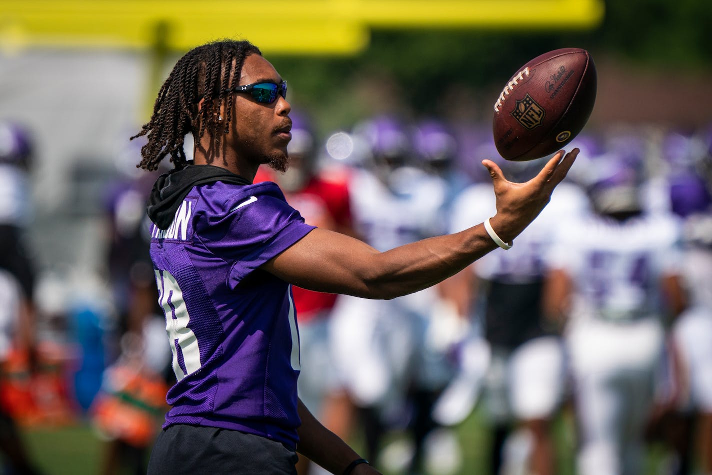 Minnesota Vikings wide receiver Justin Jefferson (18) tossed a ball to himself during training camp. Jefferson was at practice without a helmet and pads Monday after suffering an injury to his shoulder during camp on Friday. ] LEILA NAVIDI • leila.navidi@startribune.com