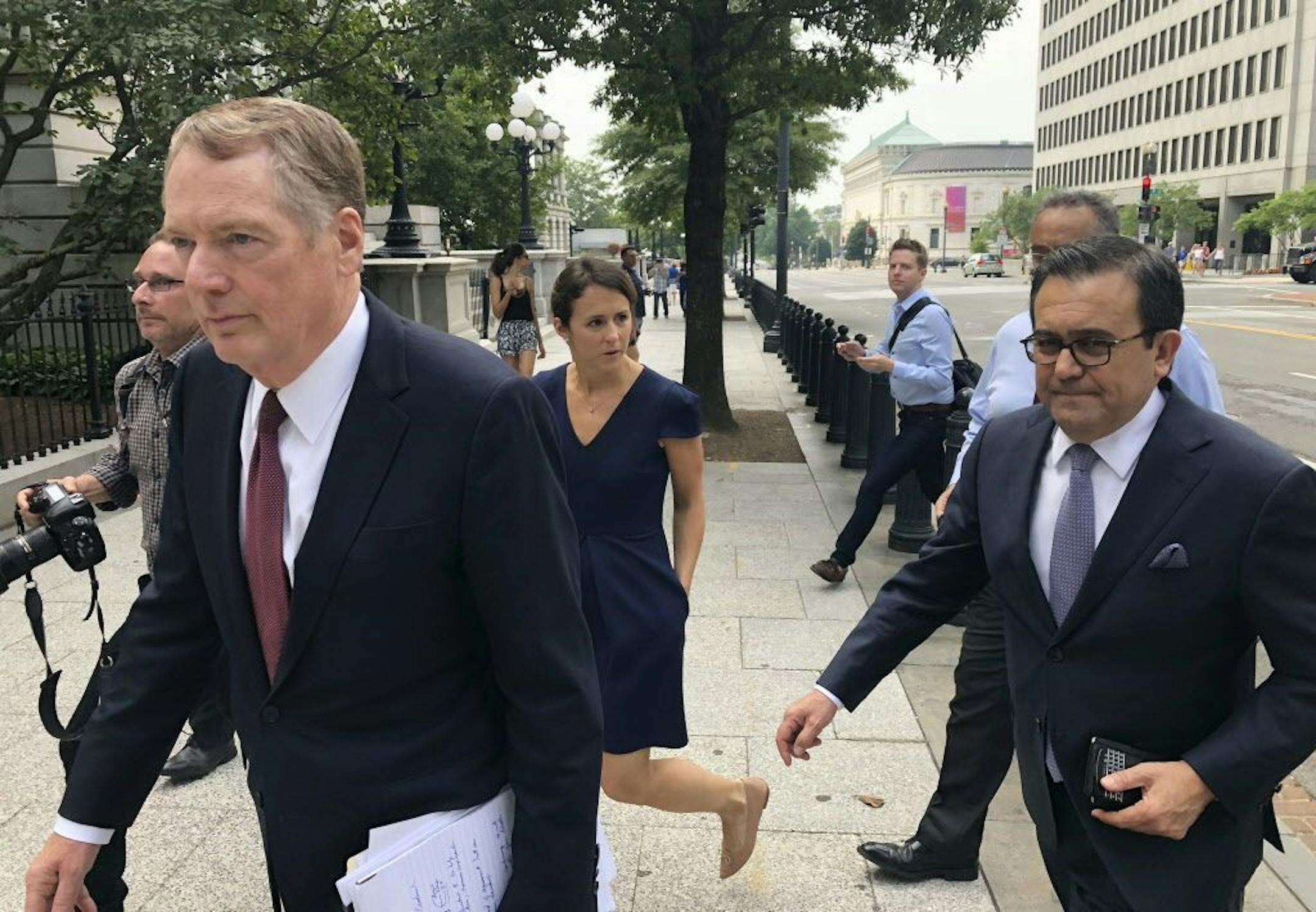 United States Trade Representative Robert Lighthizer, left, and Mexican Secretary of Economy Idelfonso Guajardo, right, walk to the White House on Monday August 27, 2018. President Donald Trump says the prospects are "looking good" for an agreement with Mexico that could set the stage for an overhaul of the North American Free Trade Agreement.
