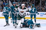 Wild rookie Liam Ohgren (28) celebrates after scoring his first career NHL goal, coming in his second game, Saturday night against the Sharks in San J