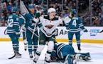 Wild rookie Liam Ohgren (28) celebrates after scoring his first career NHL goal, coming in his second game, Saturday night against the Sharks in San J