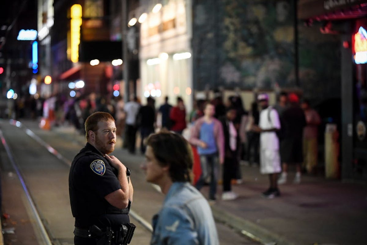 A Minneapolis police officer was watching out for trouble after bar closing time along 5th Street near Hennepin Avenue.