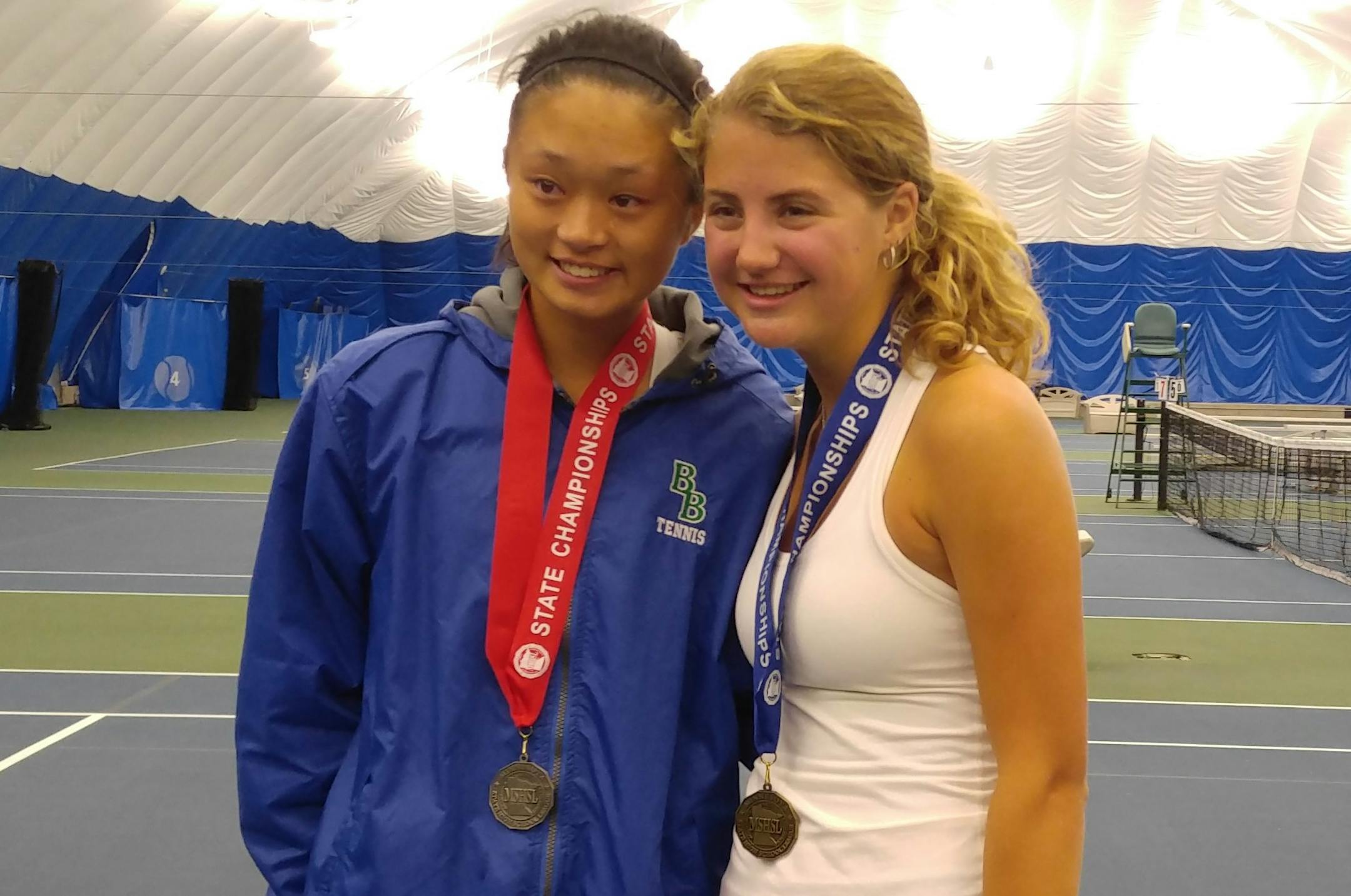 Blake teammates Arlina Shen and Lainey Axell posed with their medals. Axell defeated Shen for the Class 1A singles championship.
