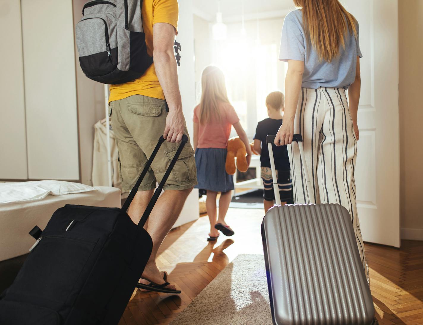 Shot of a happy family leaving their home for a vacation