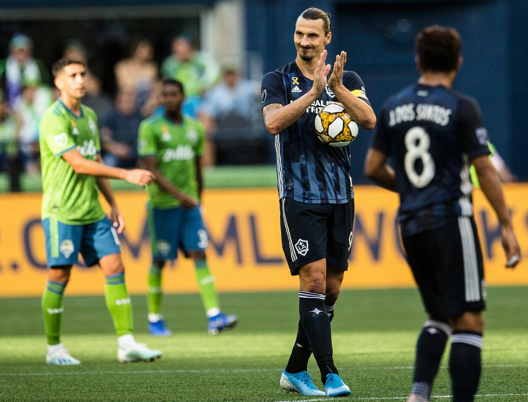 Los Angeles Galaxy's Zlatan Ibrahimovic claps after tying the score against the Seattle Sounders during an MLS soccer game on Sept. 1 at CenturyLink Field in Seattle.