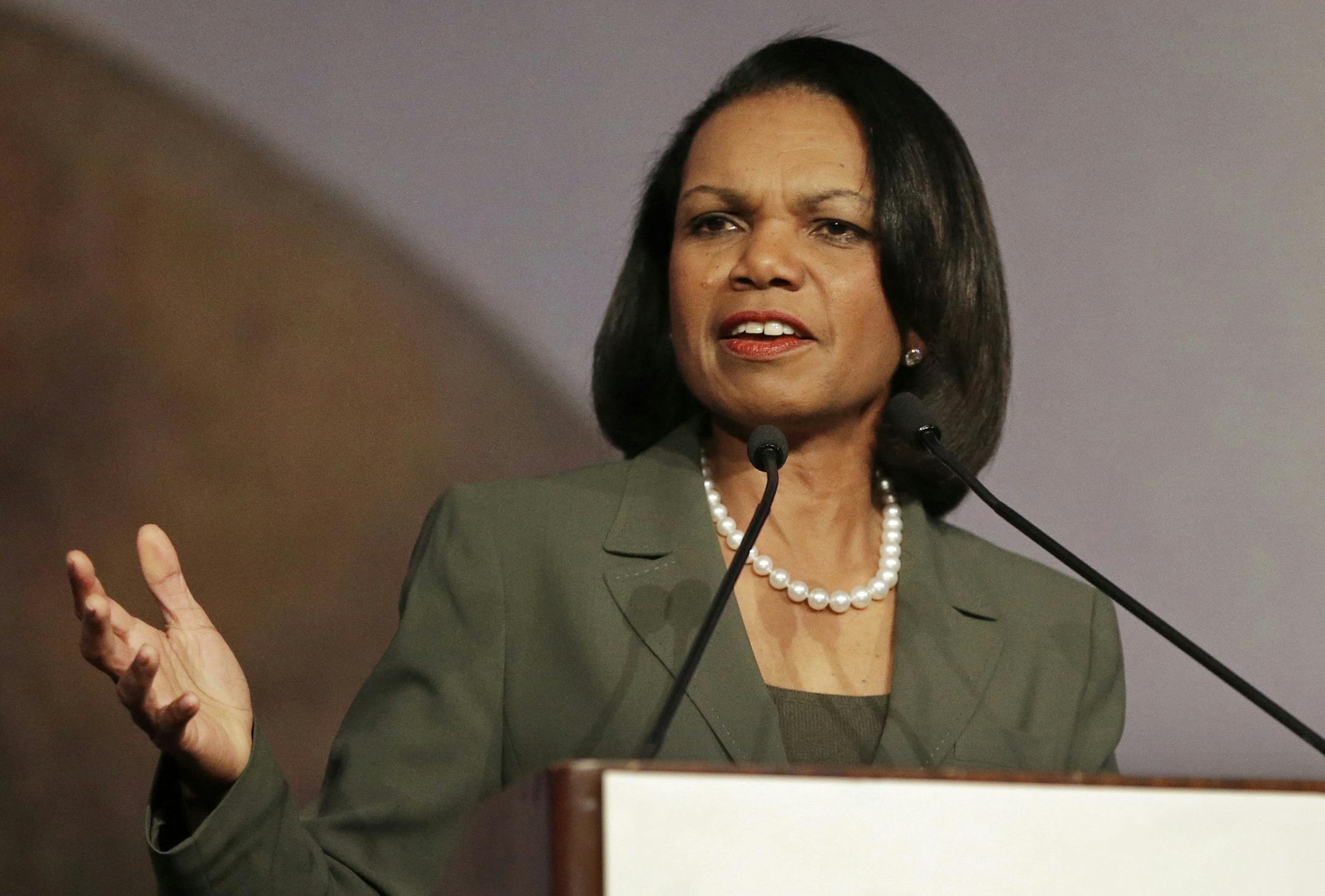 FILE - In this March 15, 2014 file photo, former Secretary of State Condoleezza Rice gestures while speaking at the California Republican Party 2014 Spring Convention in Burlingame, Calif. University of Minnesota faculty and student activists are pressuring the school to rescind its invitation to Rice to speak at the Twin Cities campus April 17 as part of the Humphrey School of Public Affairs‚Äô lecture series. Math professor William Messing has introduced a resolution to be con