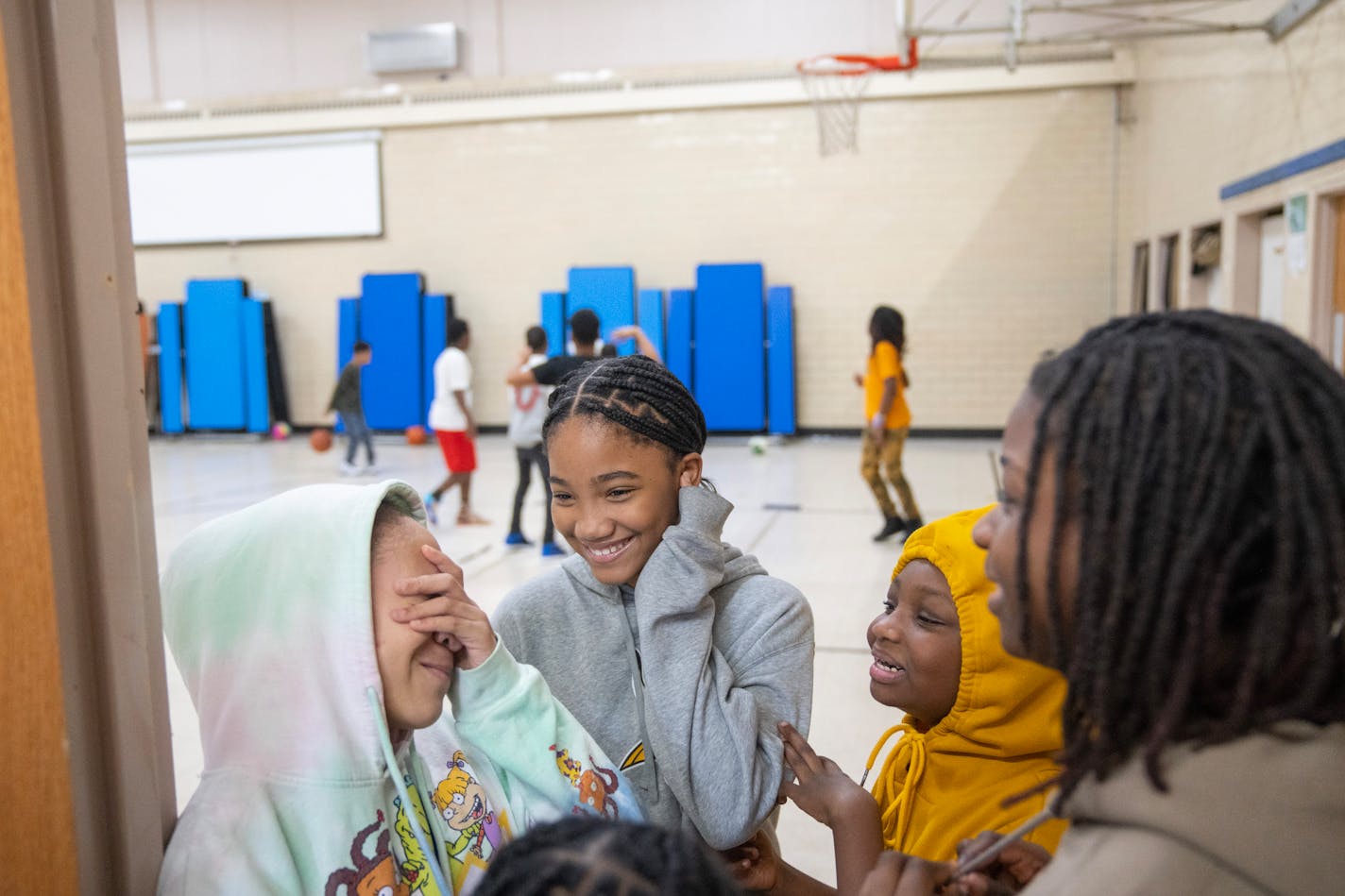 Students at JJ Legacy School laugh with one another during recess Wednesday, Jan. 10, 2024, at JJ Legacy School in Minneapolis, Minn. The school is being forced to close its doors on Friday due to insurmountable debt. ]