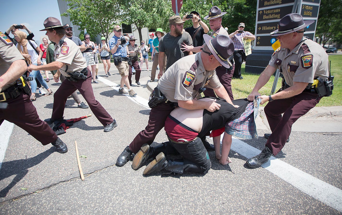 An anti-Sharia law group and antifascist protesters clashed during dueling rallies at the Minnesota State Capitol, Saturday, June 10, 2017 in St. Paul.