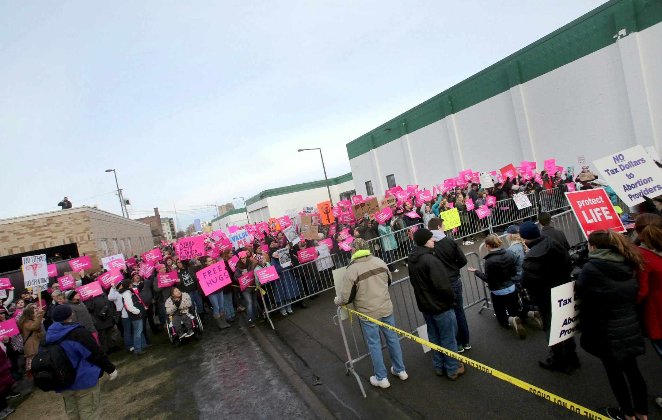 Pro-Life Action Ministries supporters, right, squared off with the Defend Planned Parenthood supporters.