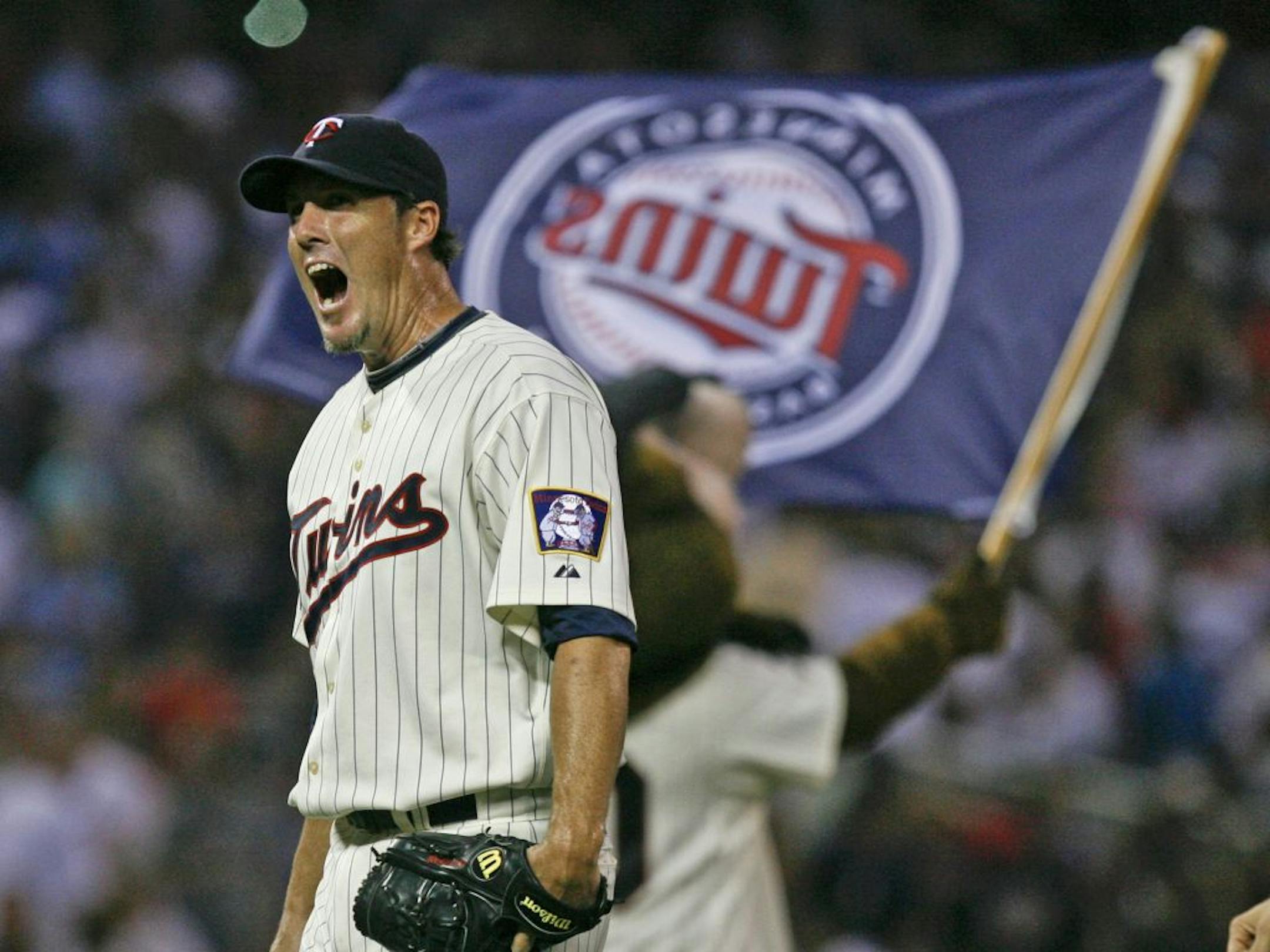 Twins closer Joe Nathan lets out a yell after getting the final out in the ninth inning the Minnesota Twins 4-3 win over Kansas City Royals game at Target Field, Saturday, July 16, 2011.