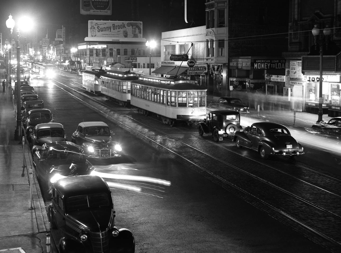 Photo courtesy Minnesota Historical Society
1949 looking south on Hennepin Ave toward Fifth Street. Augie's Bar is behind the streetcars.