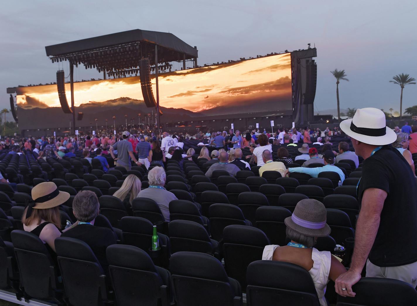 Festival goers wait for Bob Dylan's set to begin in the early evening on day 1 of the 2016 Desert Trip music festival at Empire Polo Field on Friday, Oct. 7, 2016, in Indio, Calif. (Photo by Chris Pizzello/Invision/AP)