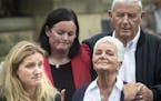 Kim Leadbeater, left, the sister of Labour Member of Parliament, Jo Cox, speaks to the media as she visited floral tributes with her parents Jean, rig